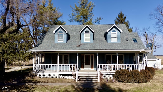 view of front facade with a porch and a shingled roof