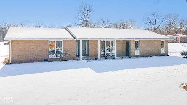 view of snow covered property