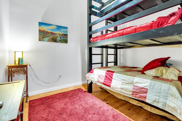 bedroom with hardwood / wood-style floors