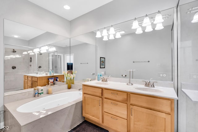 bathroom featuring vanity and shower with separate bathtub