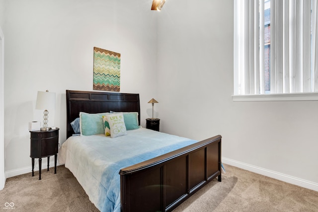 bedroom with light carpet