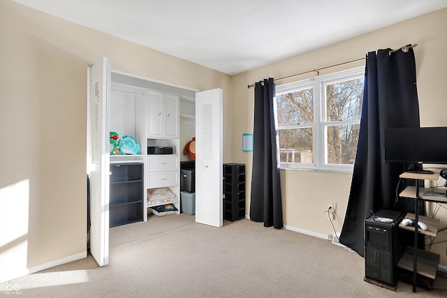 office area with light colored carpet