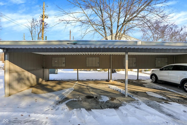 view of snow covered parking