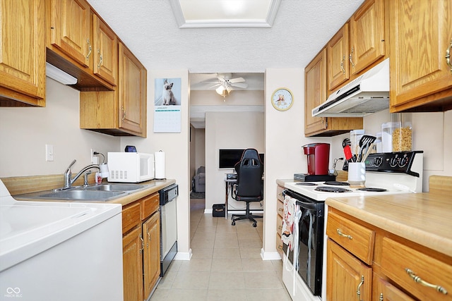 kitchen featuring a textured ceiling, white appliances, ceiling fan, and sink