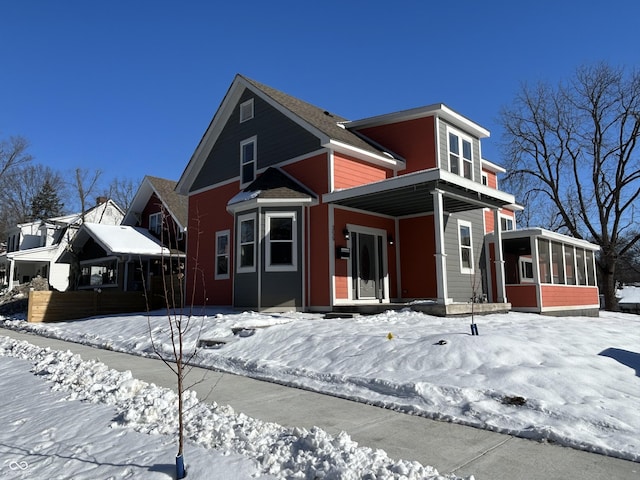 view of front facade featuring a sunroom