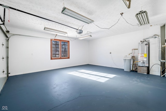 garage featuring a garage door opener and water heater