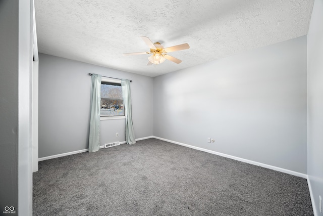 spare room featuring carpet flooring, a textured ceiling, and ceiling fan