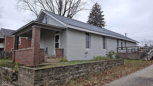 view of property exterior featuring covered porch