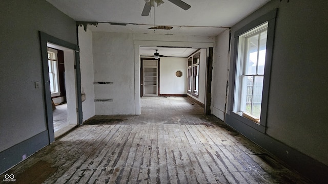 corridor featuring wood-type flooring