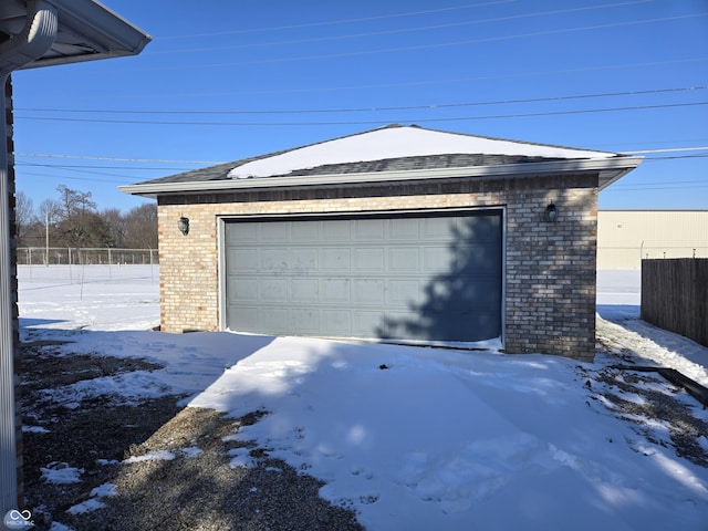 view of snow covered garage