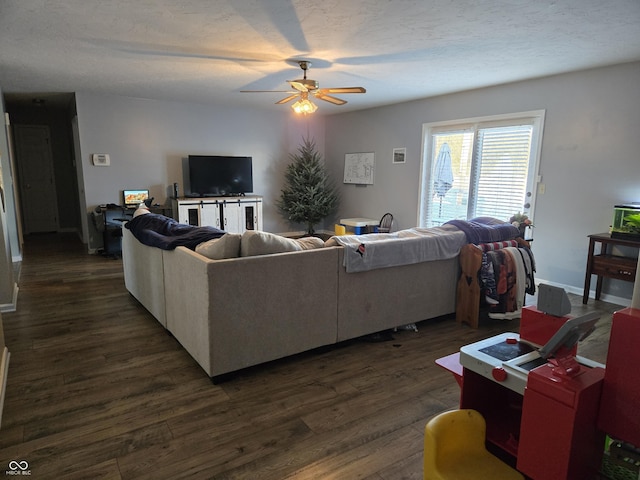 living room with dark hardwood / wood-style floors and ceiling fan