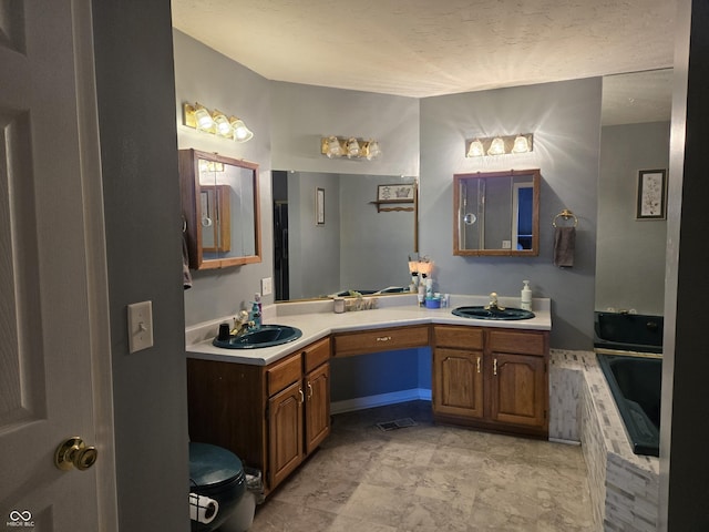 bathroom featuring vanity and a bathing tub