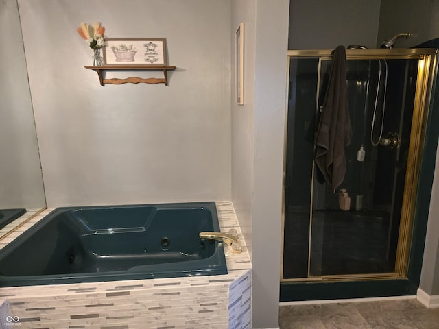 bathroom featuring shower with separate bathtub