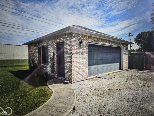 view of property exterior featuring a garage and an outdoor structure