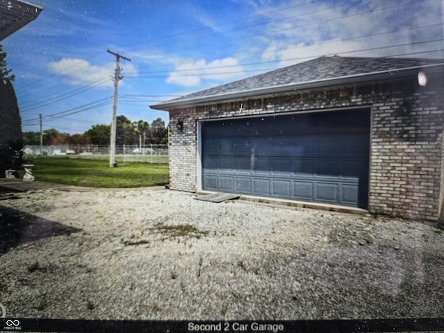 garage with a yard