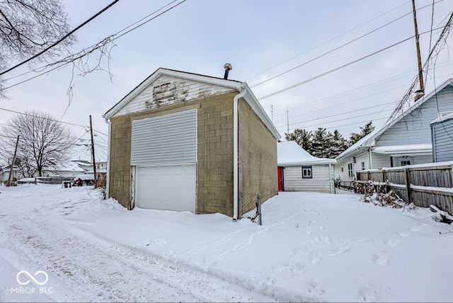 view of snow covered garage