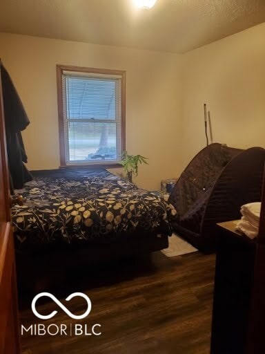 bedroom featuring dark hardwood / wood-style floors