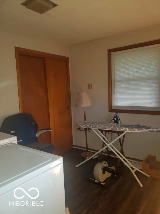 interior space featuring washer / clothes dryer and hardwood / wood-style flooring