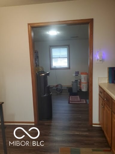 hallway featuring dark wood-type flooring