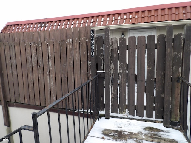 view of snow covered gate