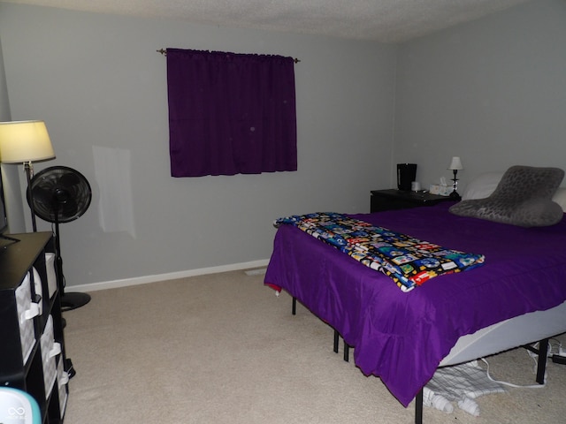 carpeted bedroom with a textured ceiling