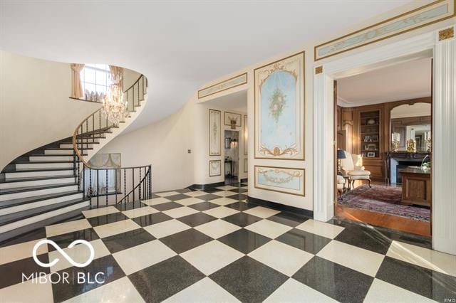 foyer with a notable chandelier