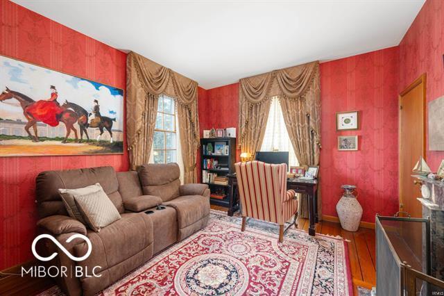 sitting room with hardwood / wood-style flooring