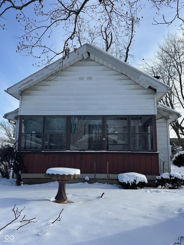 exterior space with a sunroom