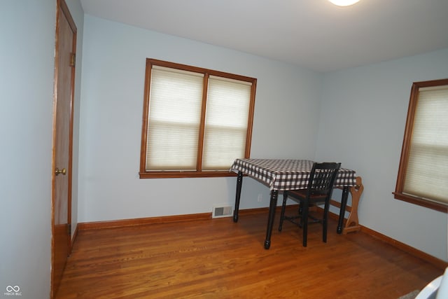 dining space featuring wood-type flooring