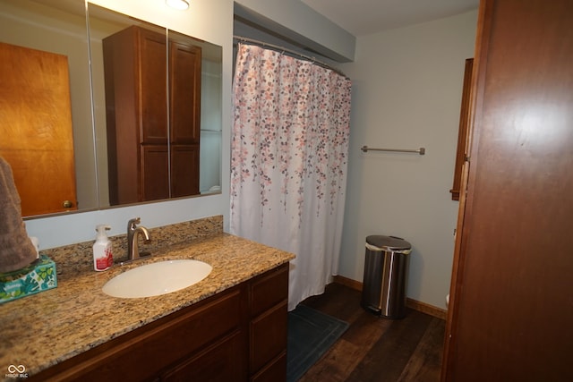 bathroom featuring vanity and wood-type flooring