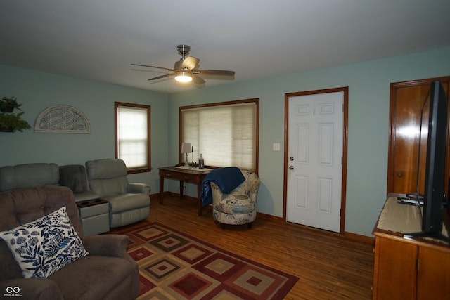 living room with ceiling fan and dark hardwood / wood-style flooring