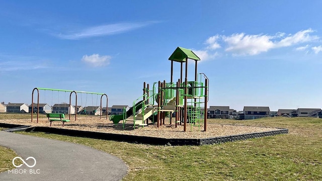 view of jungle gym featuring a lawn