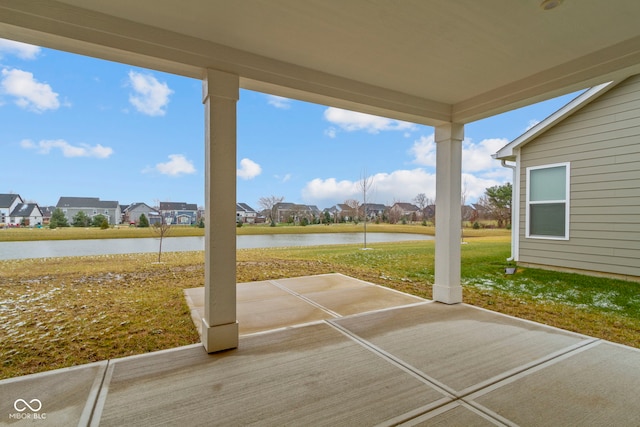 view of patio / terrace featuring a water view and a residential view