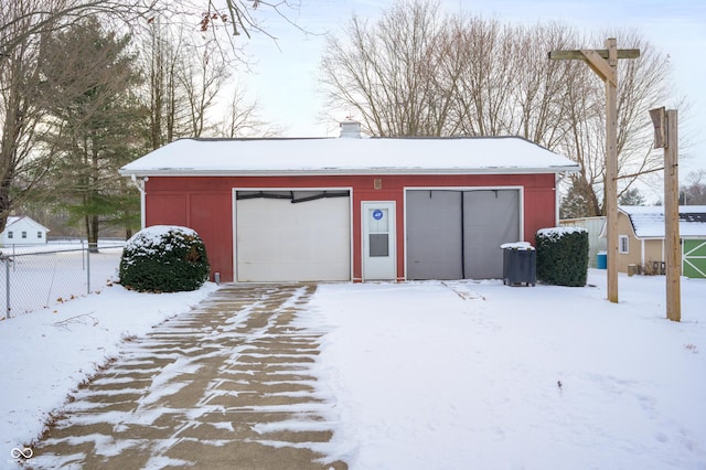 view of snow covered garage