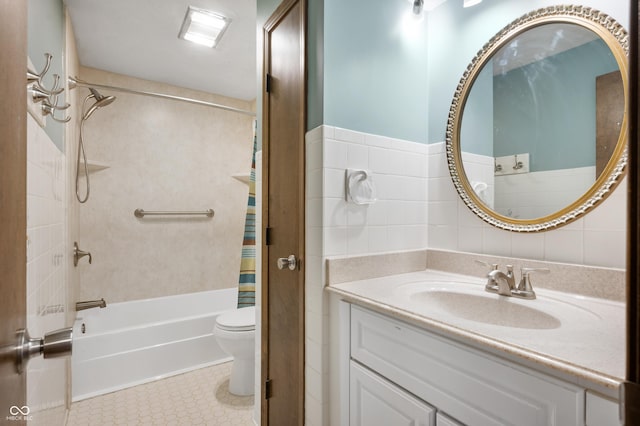 full bathroom featuring vanity, toilet, shower / bath combo with shower curtain, and tile walls