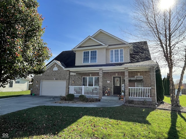 view of front facade featuring covered porch, a garage, and a front yard