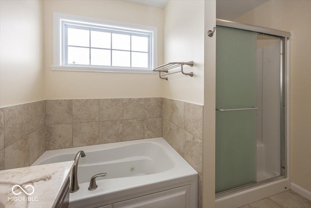 bathroom featuring vanity and separate shower and tub