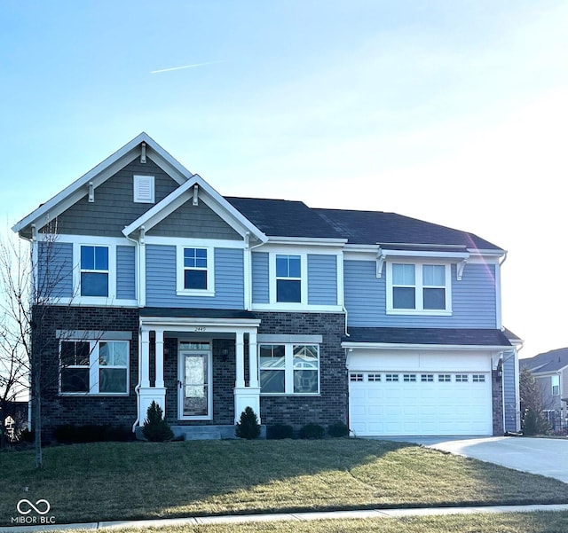 view of front of property with a front lawn and a garage