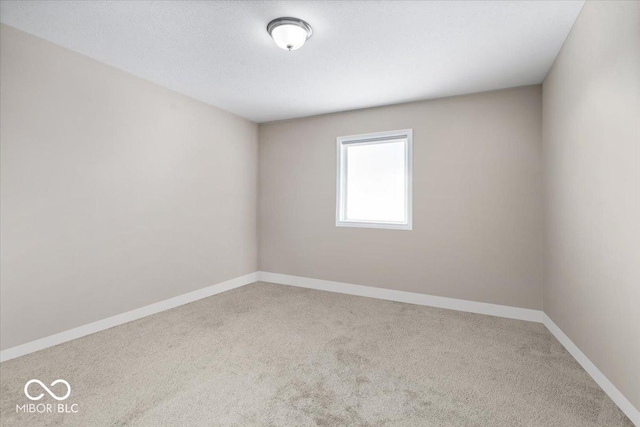 empty room with carpet flooring