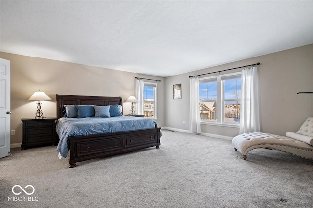 bedroom featuring light carpet