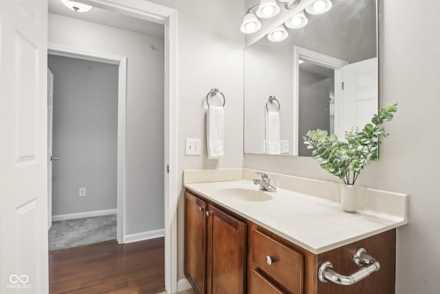 bathroom with vanity and hardwood / wood-style flooring