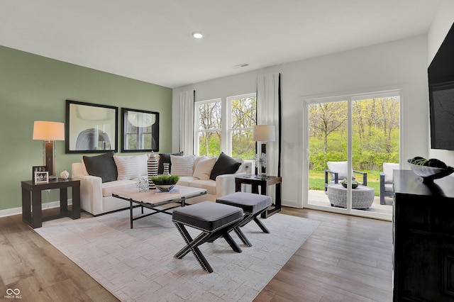 living room with light hardwood / wood-style floors