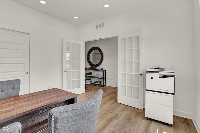 office area with light wood-type flooring and french doors