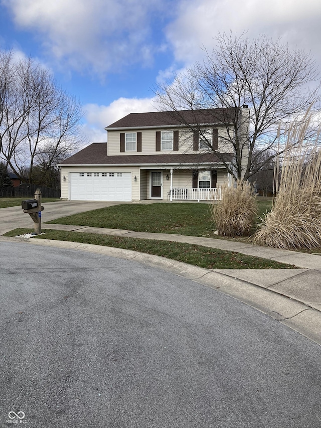 view of front facade featuring covered porch, a garage, and a front yard