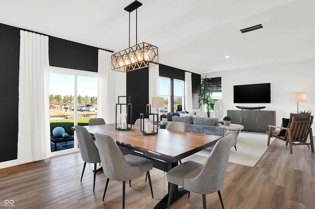 dining area with hardwood / wood-style floors