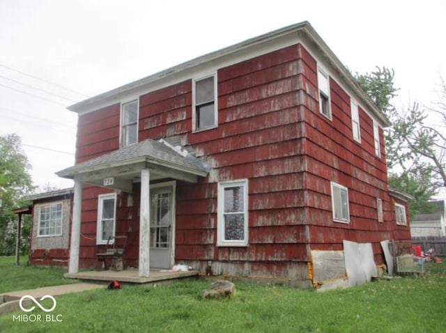 view of property exterior with a lawn