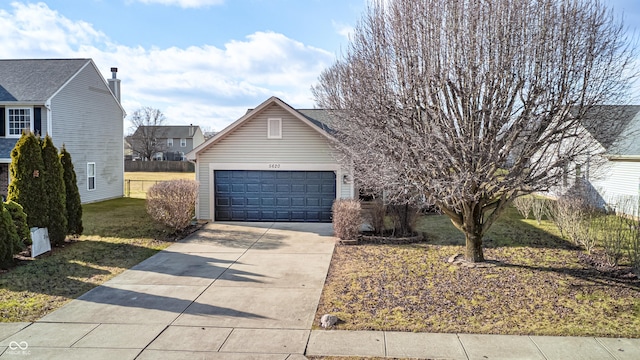 view of front of home with a garage and a front yard