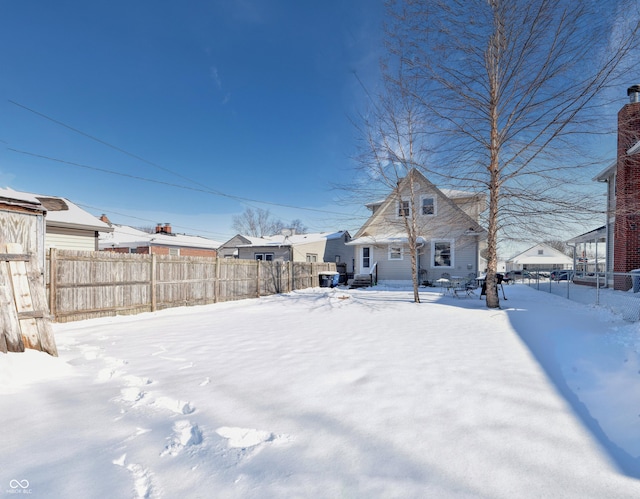 view of yard layered in snow