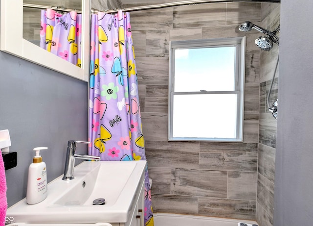 bathroom with a shower with curtain and sink