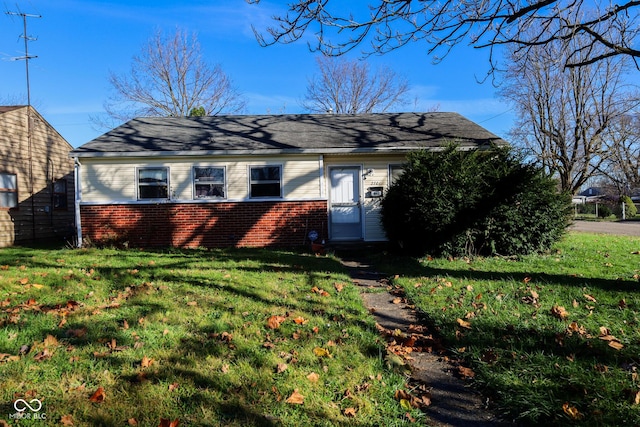 ranch-style home with a front yard